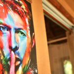 A funky colourful image of David Bowie adorns this private room at Mozambeat Motel